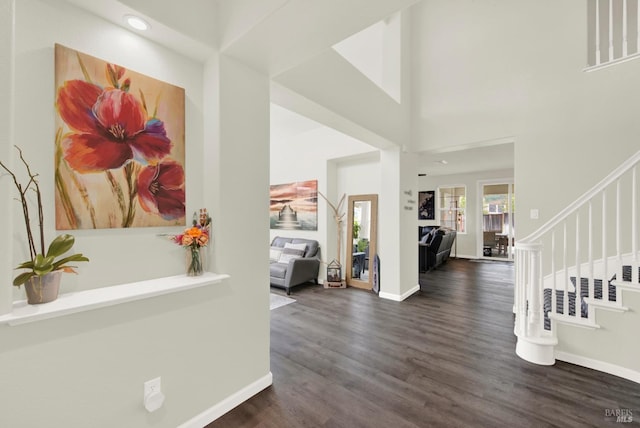 entryway featuring baseboards, recessed lighting, stairway, and dark wood finished floors