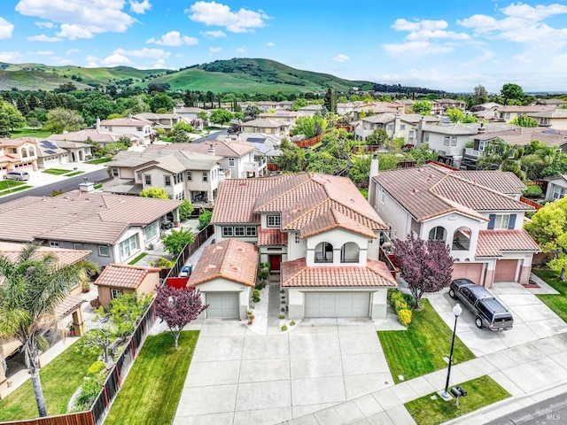 birds eye view of property with a residential view and a mountain view