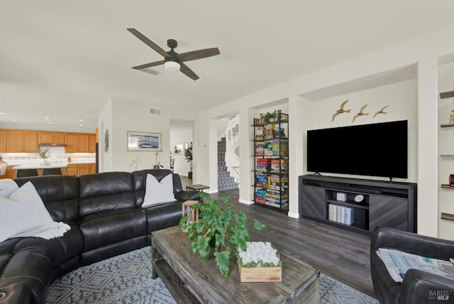 living room with built in shelves, a ceiling fan, dark wood-style floors, and recessed lighting