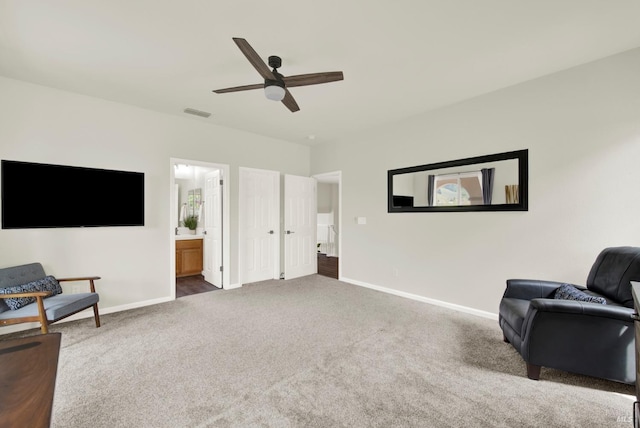 sitting room featuring visible vents, baseboards, carpet flooring, and ceiling fan