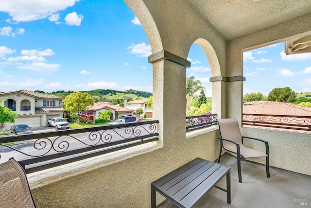 balcony featuring a residential view