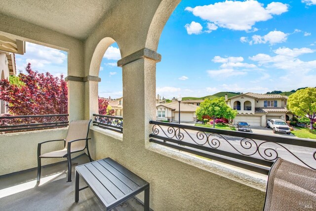 balcony featuring a residential view