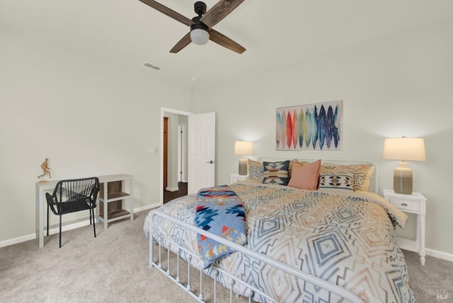 bedroom with baseboards, a ceiling fan, visible vents, and carpet