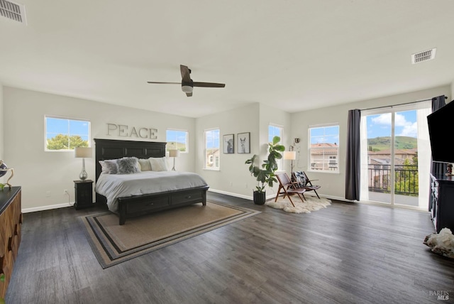bedroom featuring access to exterior, baseboards, dark wood-style flooring, and visible vents