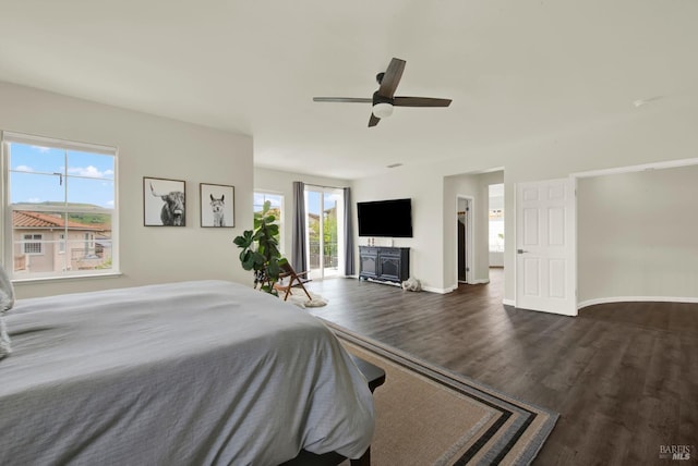 bedroom with dark wood finished floors, baseboards, and ceiling fan