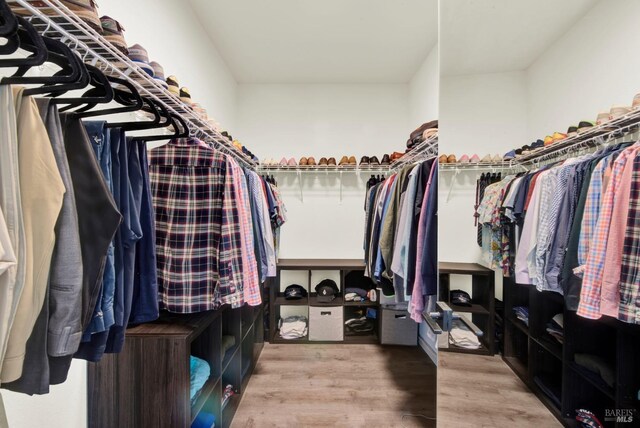 spacious closet featuring wood finished floors