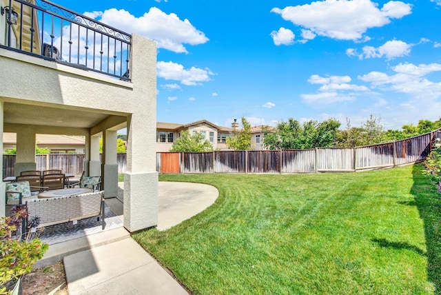 view of yard with a patio area and a fenced backyard