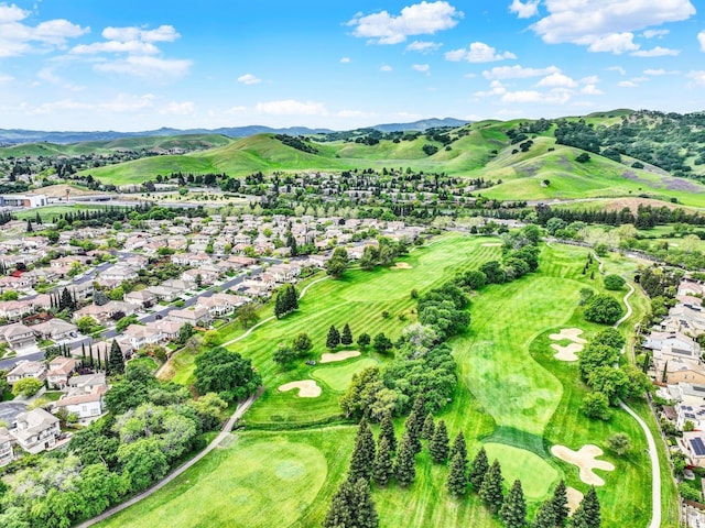 birds eye view of property with a residential view, view of golf course, and a mountain view