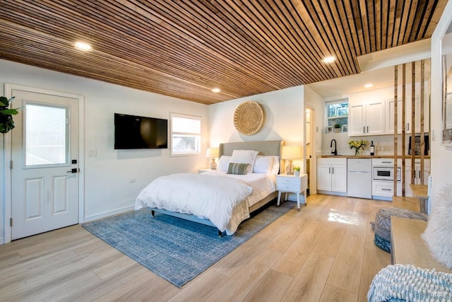 11 Cedar St, San Anselmo, CA 94960 - bedroom featuring refrigerator, a sink, multiple windows, and light wood-type flooring