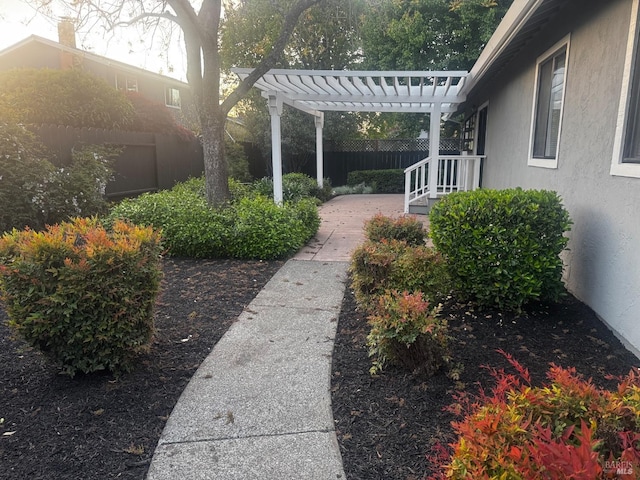 view of yard with a pergola, a patio, and fence