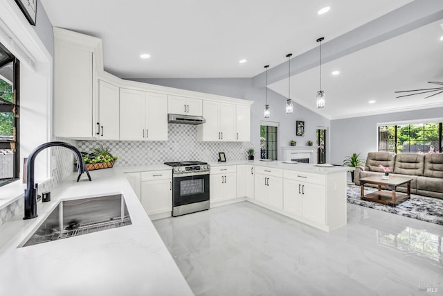 4187 Tokay Dr, Napa, CA 94558 - kitchen featuring stainless steel gas range oven, a sink, vaulted ceiling, light marble finish flooring, and a peninsula