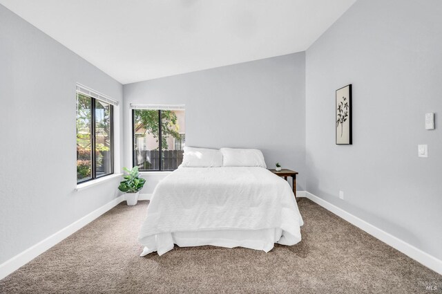 4187 Tokay Dr, Napa, CA 94558 - carpeted bedroom with lofted ceiling and baseboards