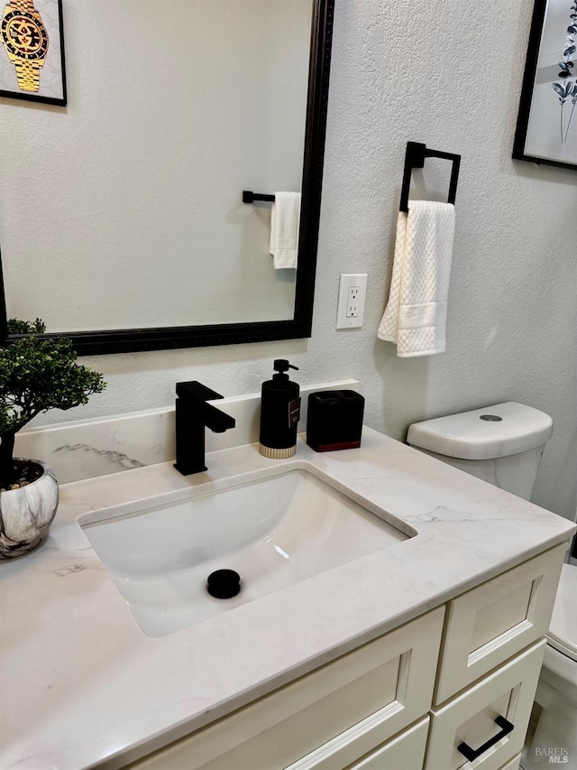 half bath with toilet and vanity