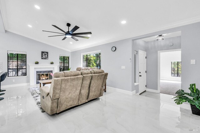 4187 Tokay Dr, Napa, CA 94558 - living area featuring crown molding, baseboards, a glass covered fireplace, a ceiling fan, and light marble finish floors