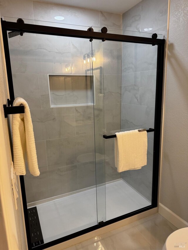 4187 Tokay Dr, Napa, CA 94558 - bathroom with a stall shower, toilet, and baseboards