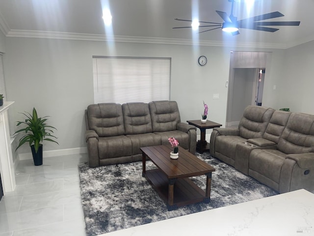 living area featuring marble finish floor, baseboards, crown molding, and ceiling fan