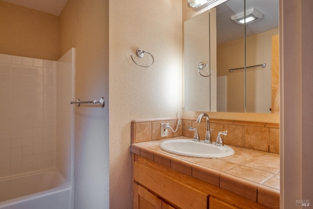16589 Glenda Dr, Guerneville, CA 95446 - bathroom with vanity, shower / tub combination, and a textured wall