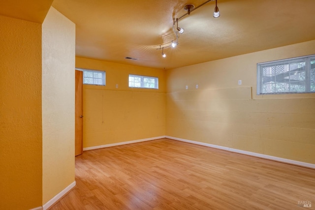16589 Glenda Dr, Guerneville, CA 95446 - unfurnished room featuring wood finished floors, baseboards, and rail lighting