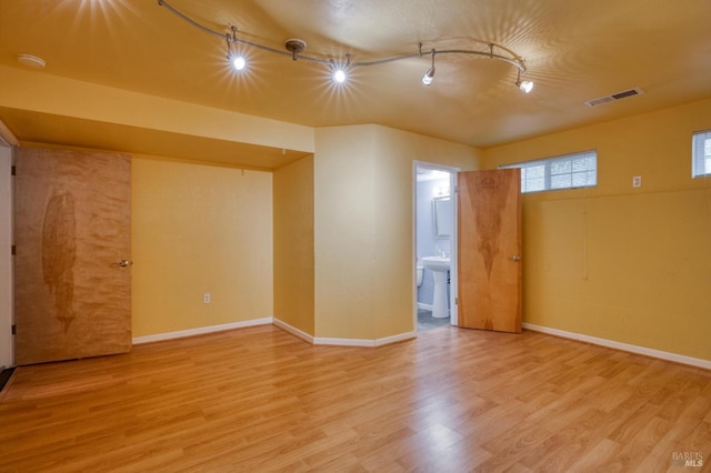 16589 Glenda Dr, Guerneville, CA 95446 - unfurnished room featuring track lighting, wood finished floors, and baseboards