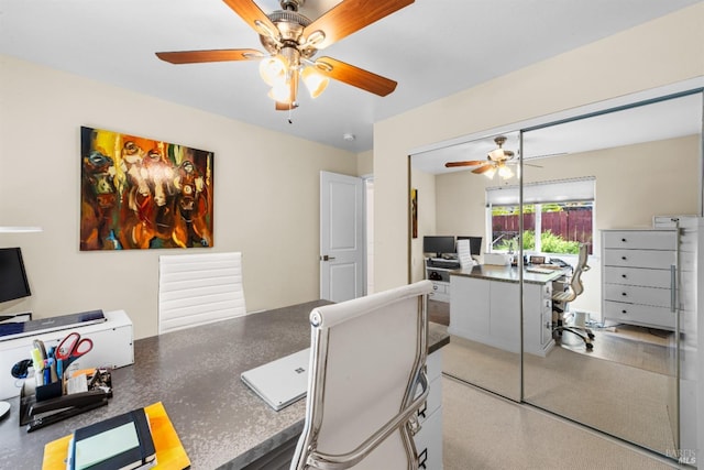 office space with a ceiling fan