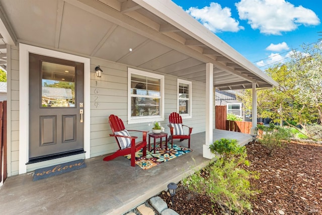 entrance to property featuring a porch