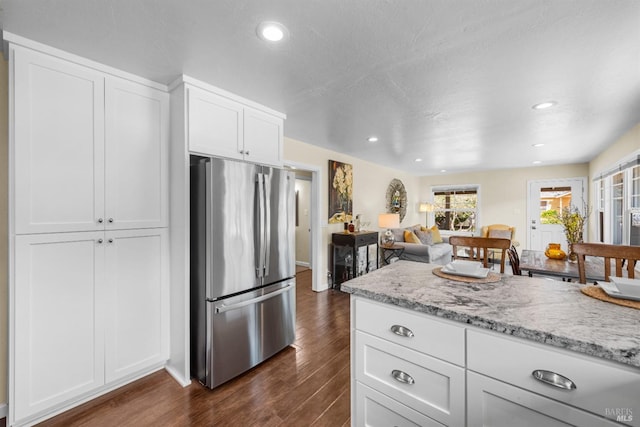1629 Ora Dr, Napa, CA 94559 - kitchen featuring freestanding refrigerator, dark wood finished floors, white cabinetry, light stone countertops, and recessed lighting