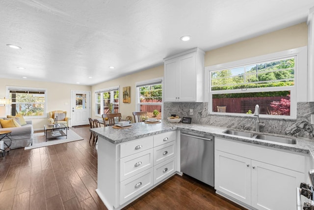 1629 Ora Dr, Napa, CA 94559 - kitchen featuring stainless steel dishwasher, a peninsula, white cabinetry, dark wood finished floors, and decorative backsplash
