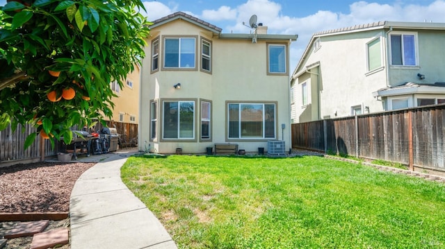 1220 Bello Dr, Dixon, CA 95620 - back of property with a chimney, a yard, central air condition unit, and stucco siding