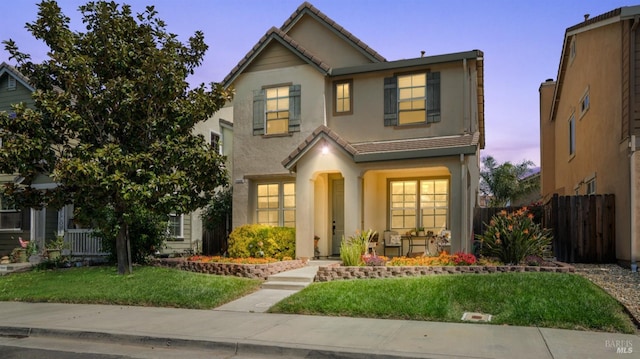 1220 Bello Dr, Dixon, CA 95620 - traditional-style home featuring stucco siding, a tile roof, a front lawn, and fence