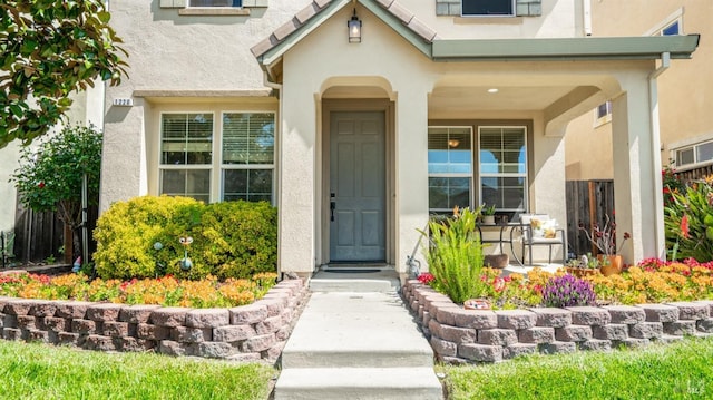 1220 Bello Dr, Dixon, CA 95620 - doorway to property featuring a porch and stucco siding