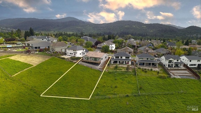 bird's eye view with a residential view and a mountain view