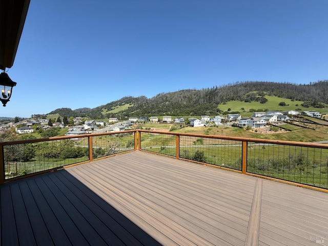 wooden deck featuring a mountain view
