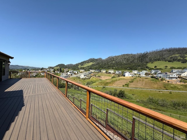 wooden deck featuring a mountain view