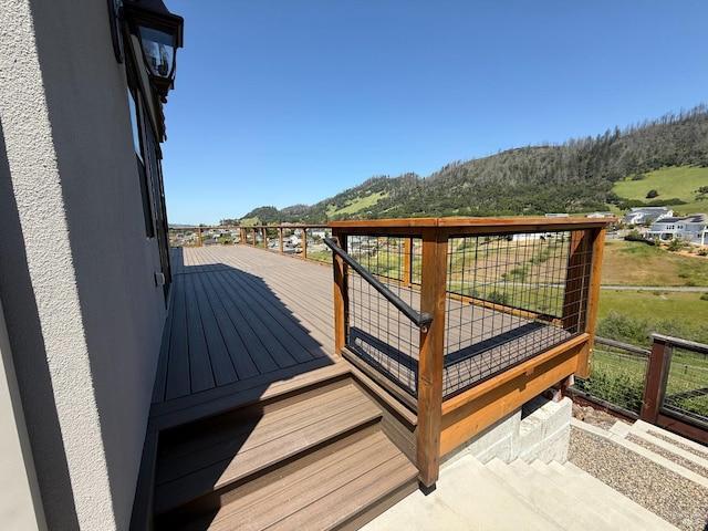 exterior space with fence, a mountain view, and a residential view