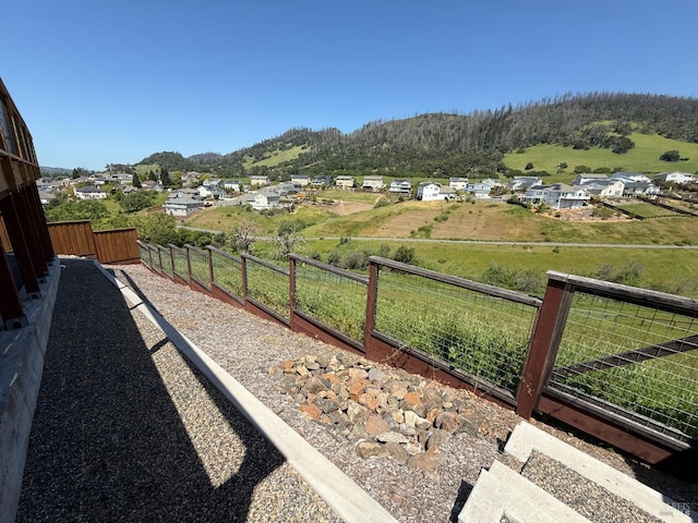 view of yard featuring a deck and fence