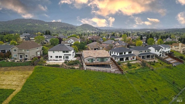 birds eye view of property featuring a mountain view and a residential view