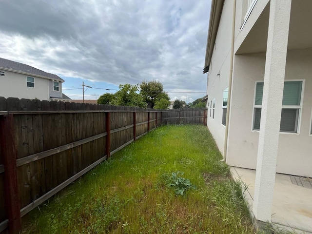 view of yard with a fenced backyard