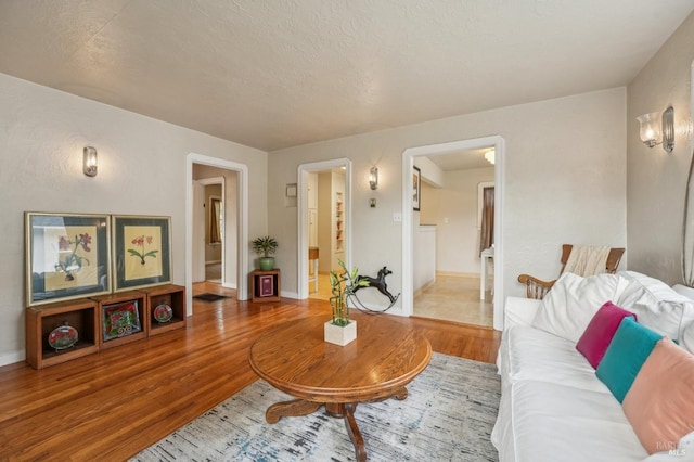 living area featuring wood finished floors and baseboards