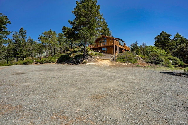 42227 Roseman Creek Rd, Gualala, CA 95445 - living area featuring baseboards, electric panel, and beamed ceiling