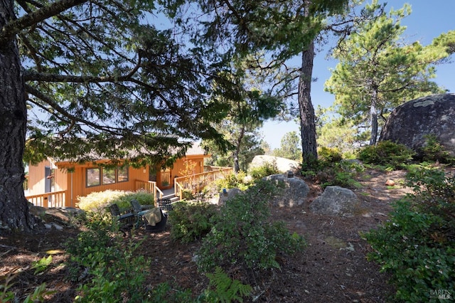 42227 Roseman Creek Rd, Gualala, CA 95445 - wooden deck featuring a wooded view