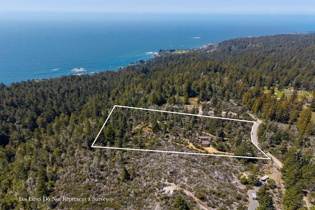 42227 Roseman Creek Rd, Gualala, CA 95445 - back of property featuring roof mounted solar panels, a view of trees, and a deck