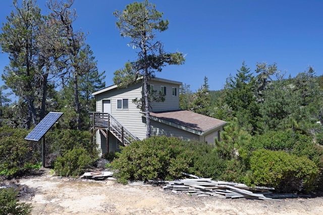 42227 Roseman Creek Rd, Gualala, CA 95445 - rear view of property featuring ground mounted solar panels and stairs