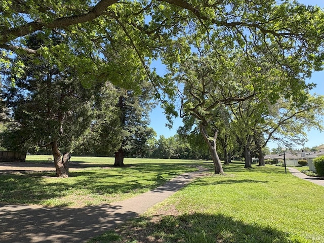 view of home's community featuring a lawn