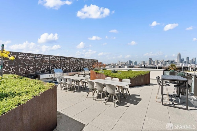 88 Arkansas St Unit 515, San Francisco, CA 94107 - view of patio featuring outdoor dining area and a skyline view