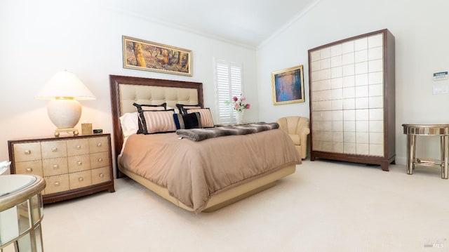 carpeted bedroom featuring lofted ceiling and crown molding