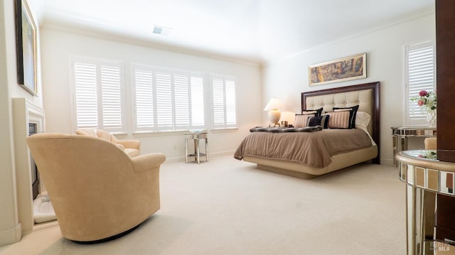 carpeted bedroom with visible vents and ornamental molding