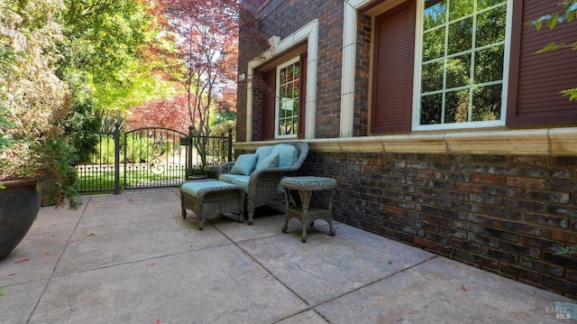 view of patio / terrace featuring a gate
