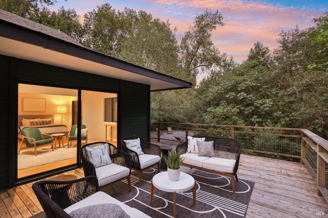 wooden terrace featuring an outdoor living space