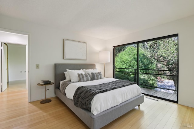 bedroom featuring light wood-style flooring