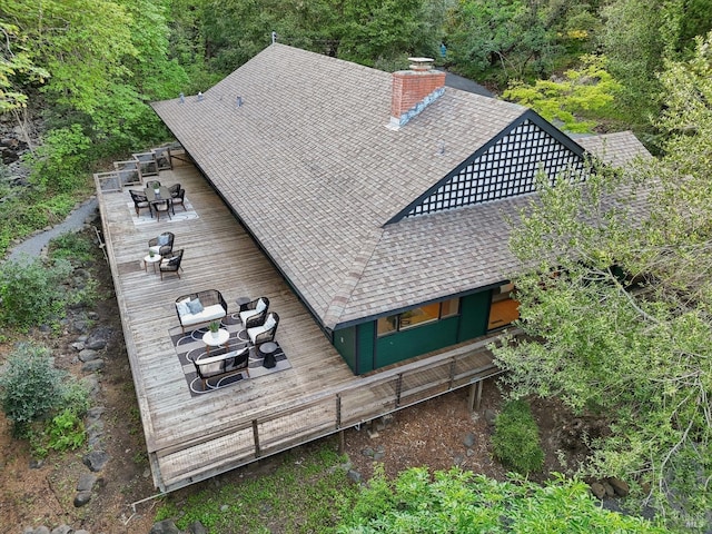 birds eye view of property with a view of trees